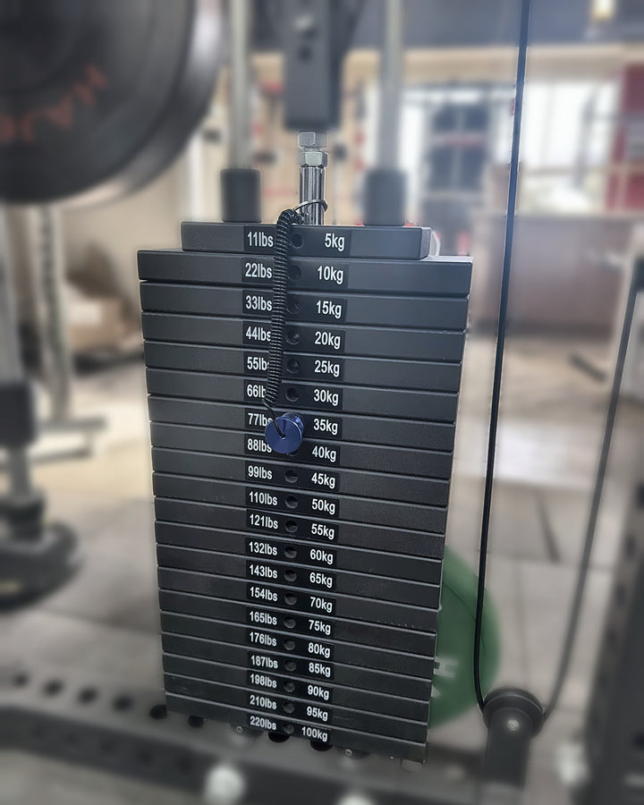 Smith Machine X4 weight stack label: 11 lb / 5 kg increments up to 220 lb / 100 kg per side