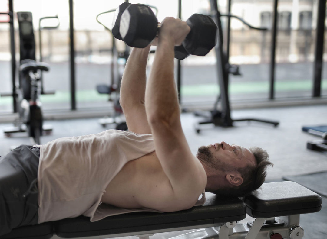 Man doing a dumbbell bench press