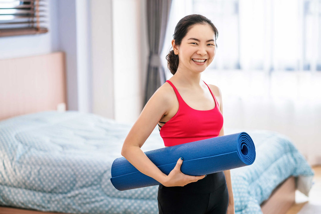 portrait-of-asian-woman-holding-the-yoga-mat