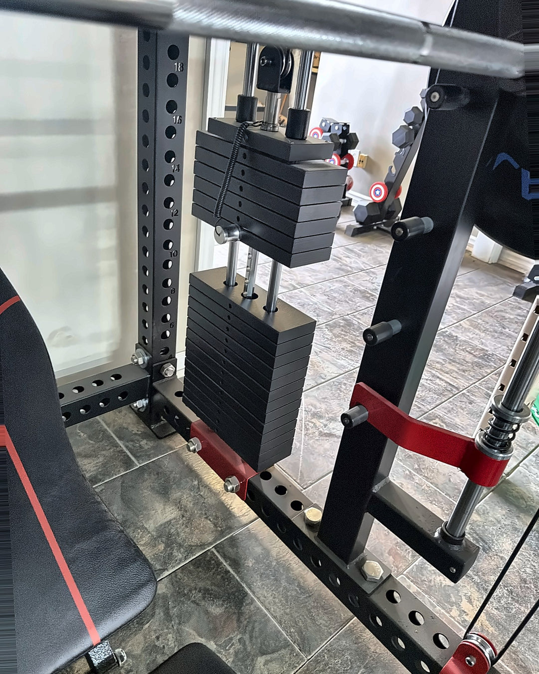 Smith Machine X3 pin-select weight stacks on the guide rods